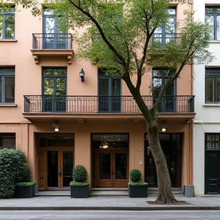 Exterior view of a stylish building in the vibrant Palermo neighborhood of Buenos Aires, highlighting the studio's prime location